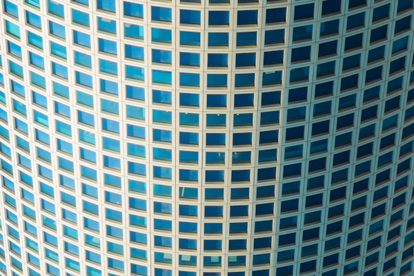 Modern skyscraper facade with blue glass windows
