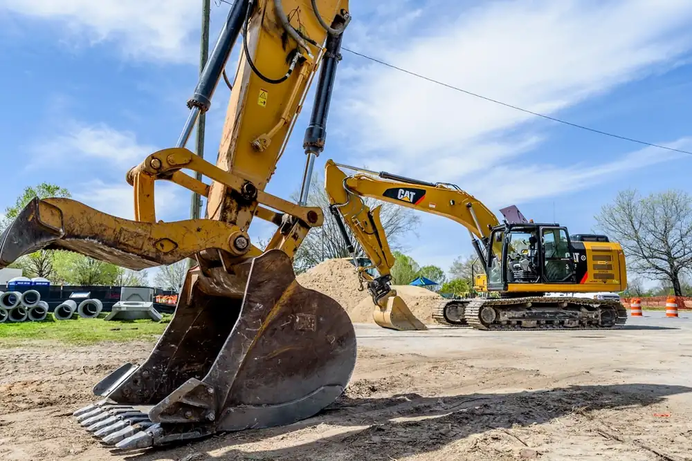 A tracked excavator parked on open ground