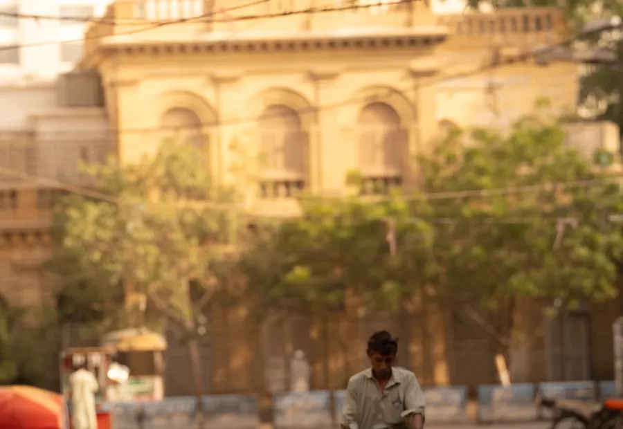 A colonial-era building on a Karachi street in late afternoon light