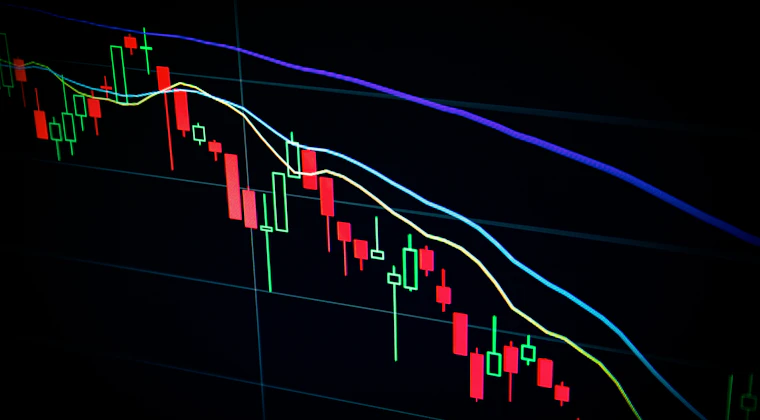 Cryptocurrency price charts displayed on a screen