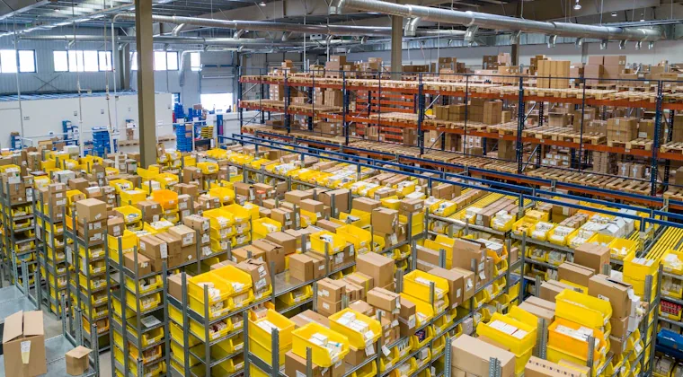 Parcels being packed for dispatch in a small warehouse