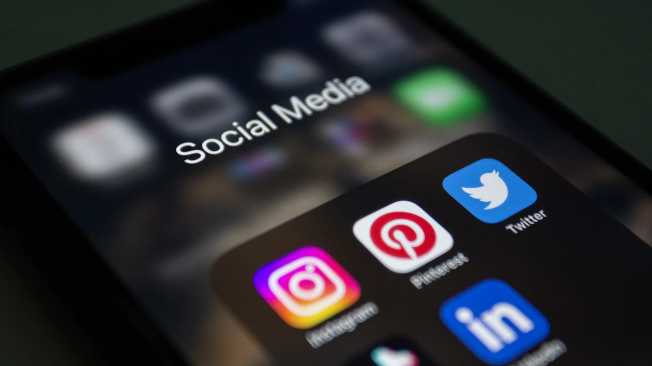 Close-up of a phone screen showing social media app icons