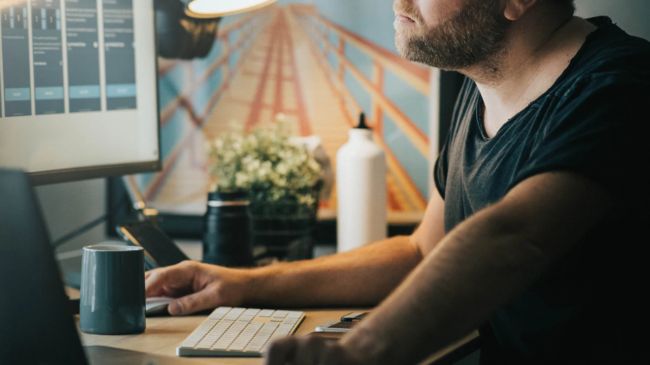 Person working at a desk with a content dashboard on screen